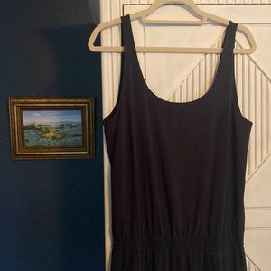 Never worn Athleta jumpsuit. Size 14. Black, elastic waist.
